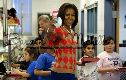 US First Lady Michelle Obama waves along